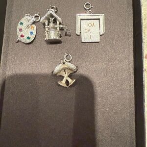 Set of 4 Monet silver bracelet charms. Bundled price